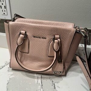 Michael Kors light pink satchel.